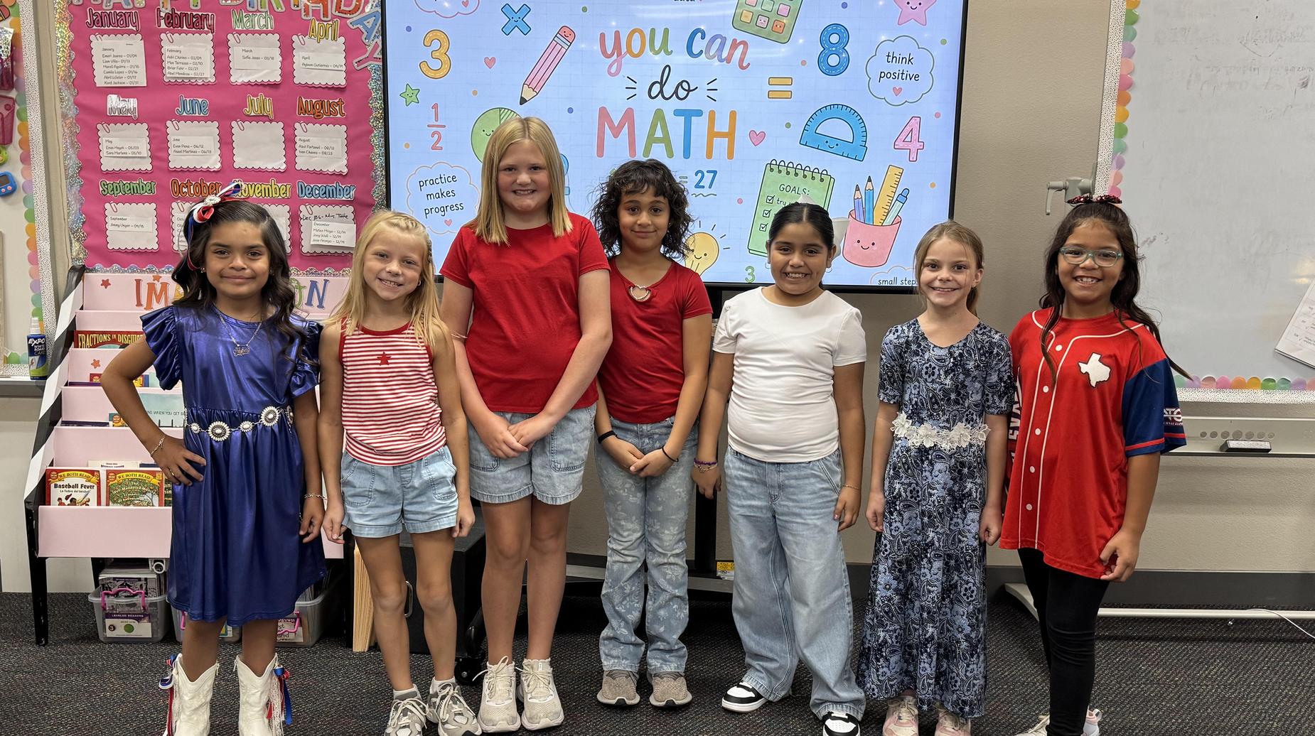 Seminole Primary students smiling in class.