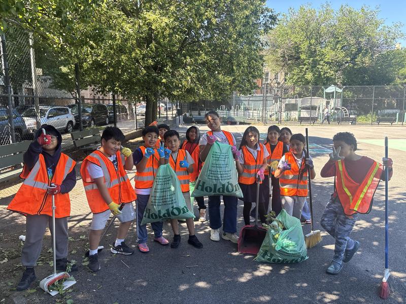 Students with their equipment cleaning up a community