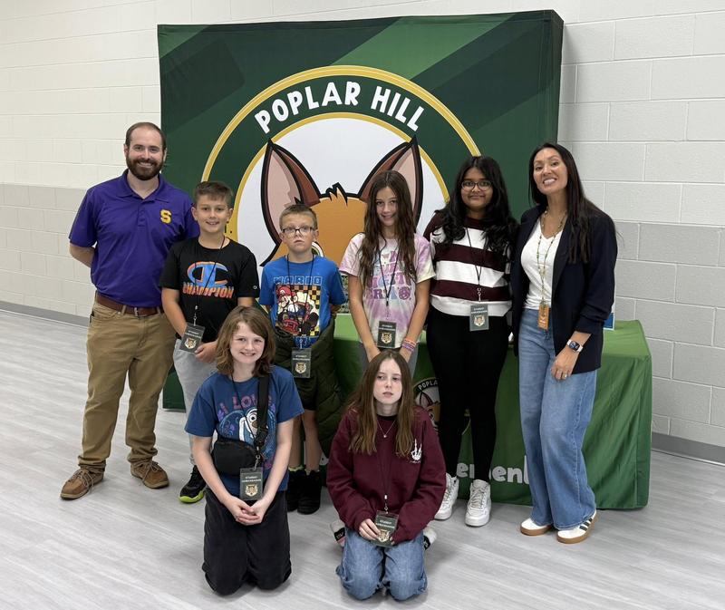 Smyrna High's Dr. Wally Luckeydoo, left, was recognized for his outreach as a personal finance educator.