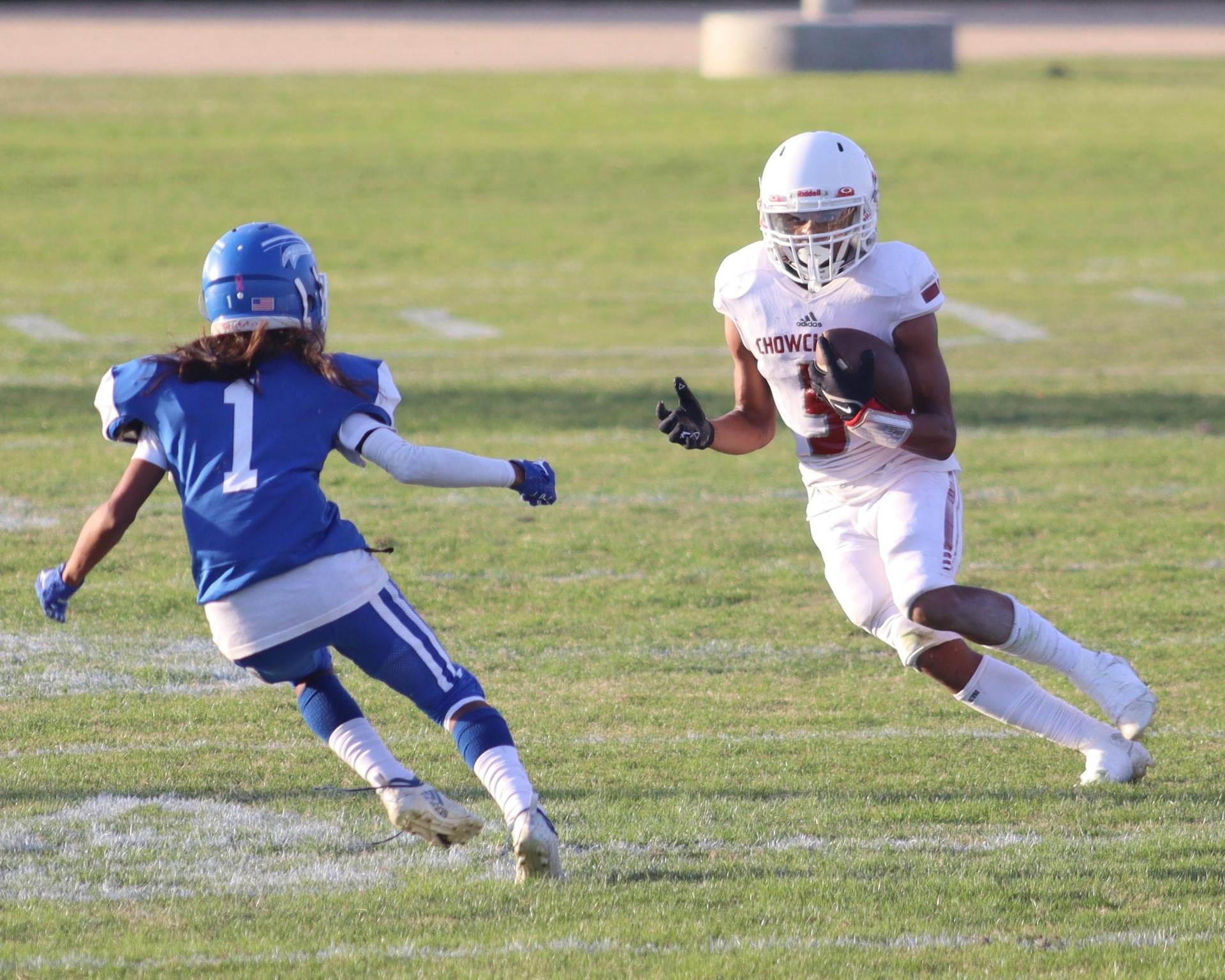 Junior Varsity football players in action against Caruthers