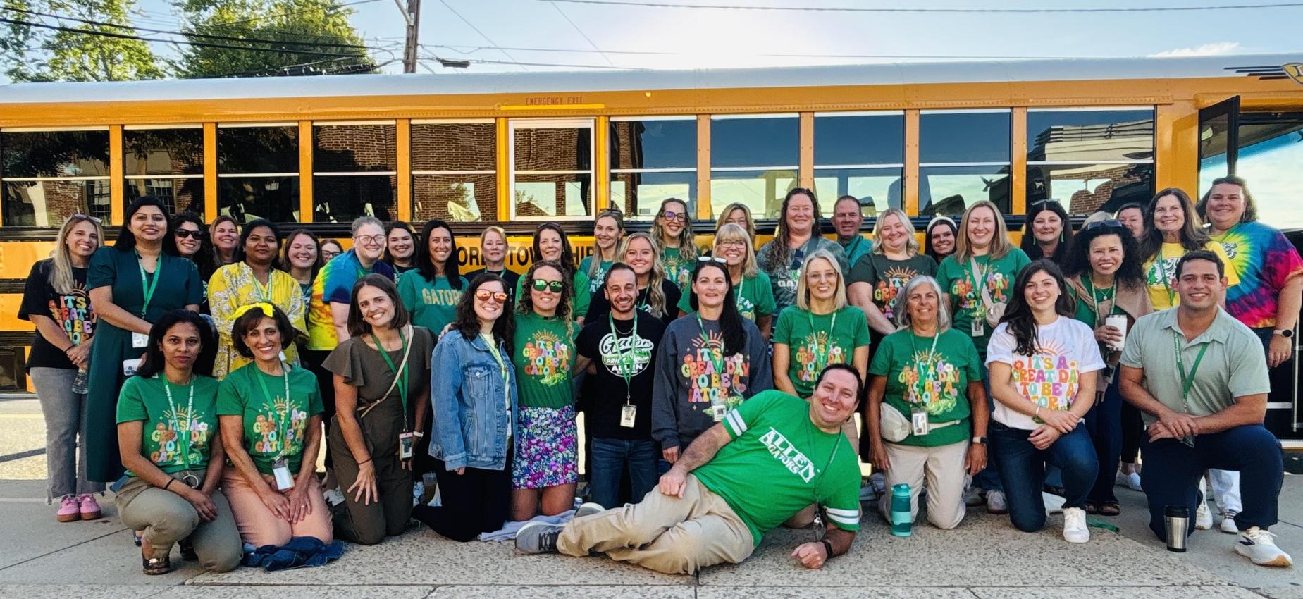 Allen School Staff Picture in front of bus