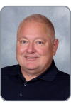 Norman McBride, a man in a navy button down shirt