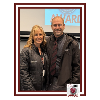 A woman and man posing for the camera
