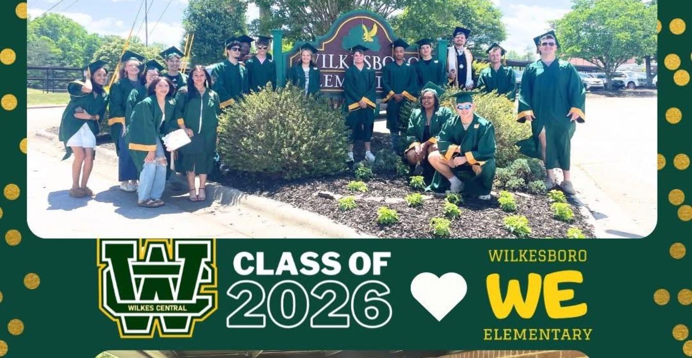Graduating class poses in caps and gowns with a green and gold theme.