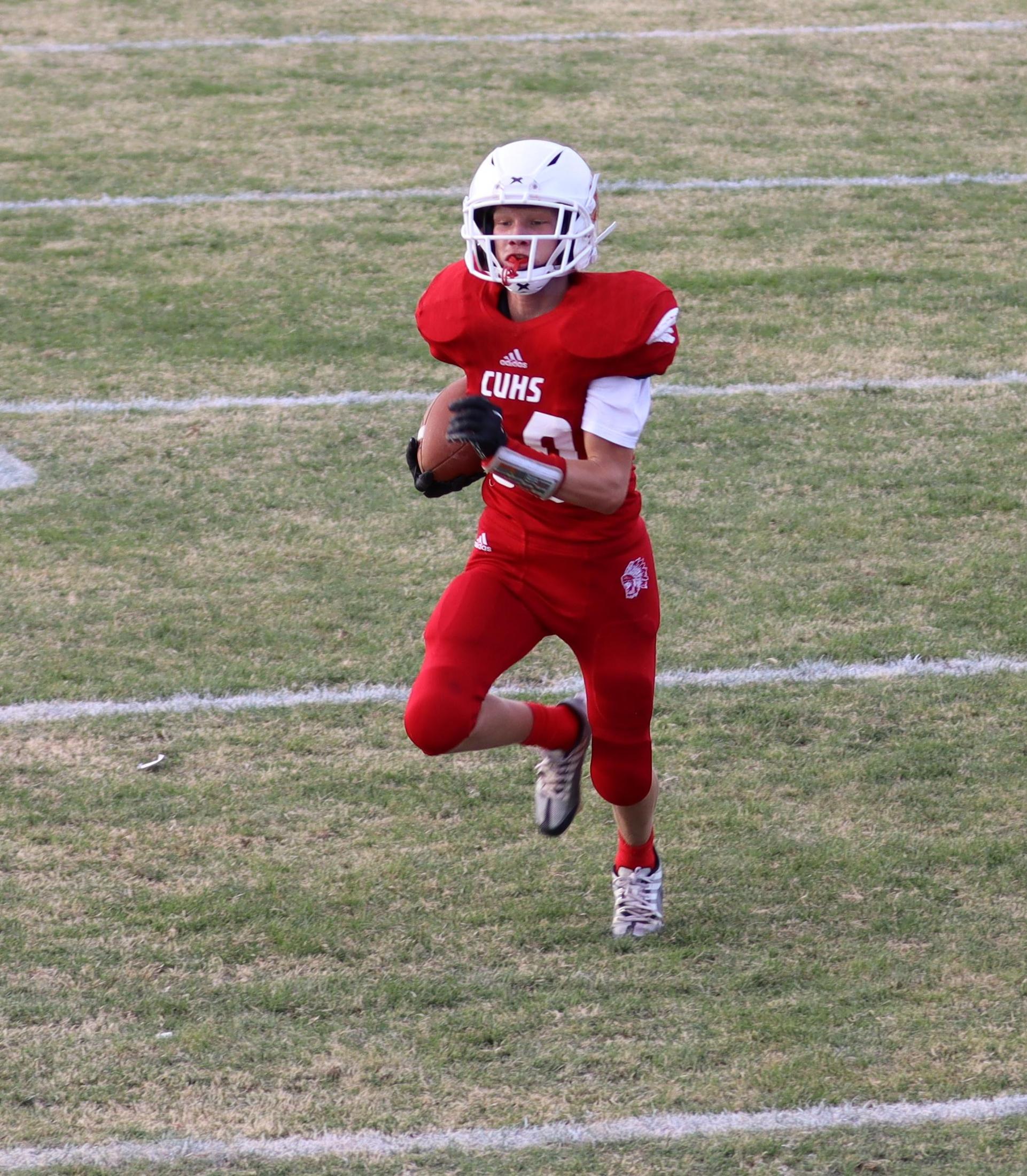  junior varsity football players in action against riverdale