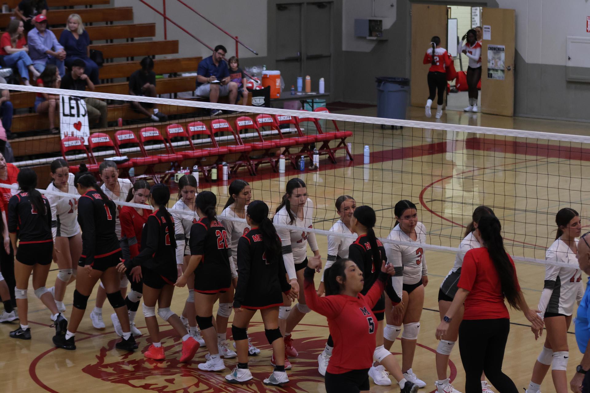 junior varsity girls playing volleyball 138
