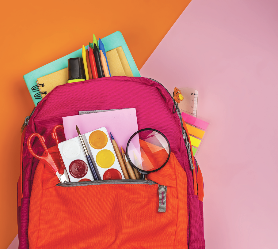 red backpack with arts supplies coming out