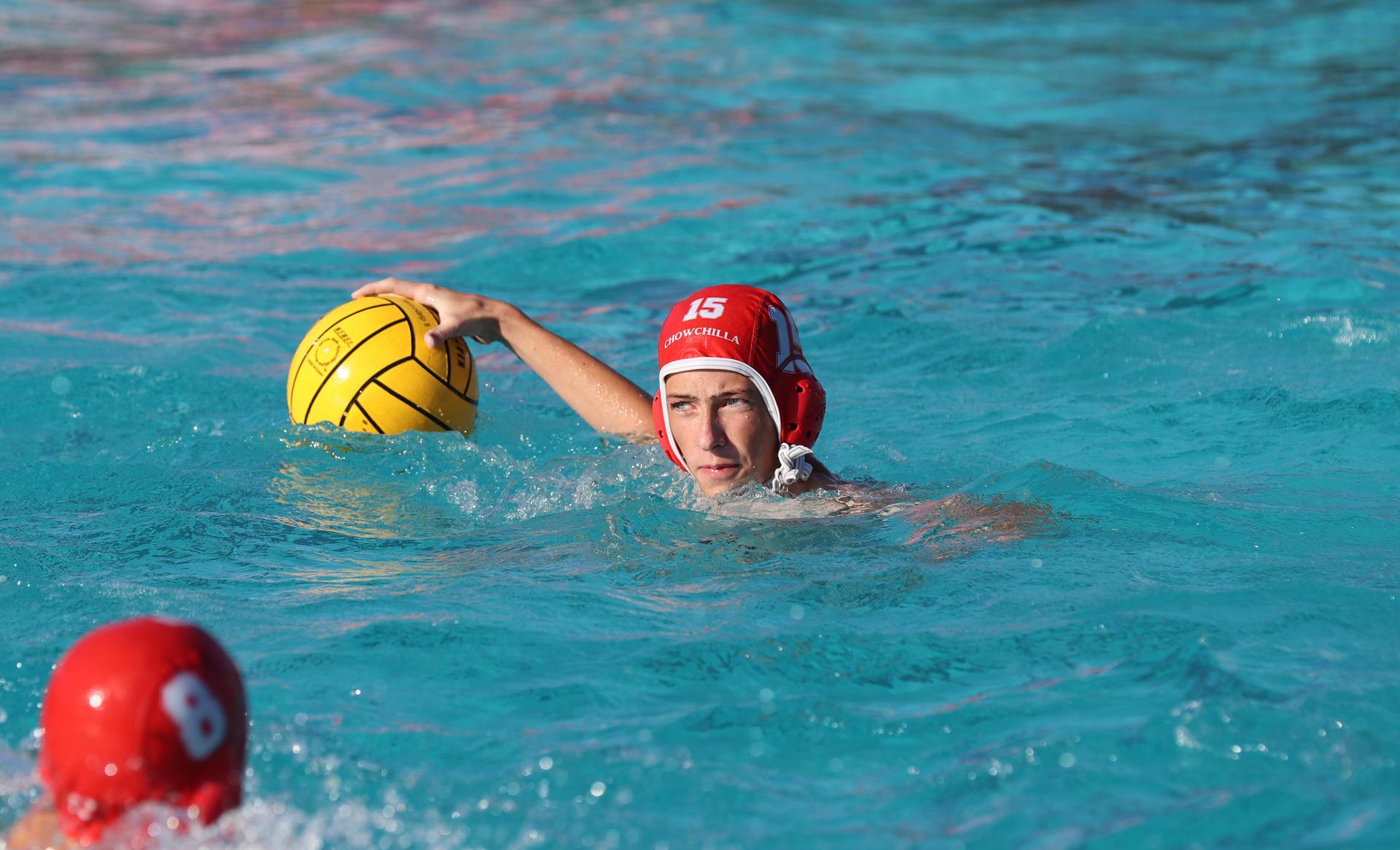 boys water polo players in action against san joaquin memorial