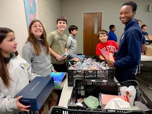 Students packing boxes