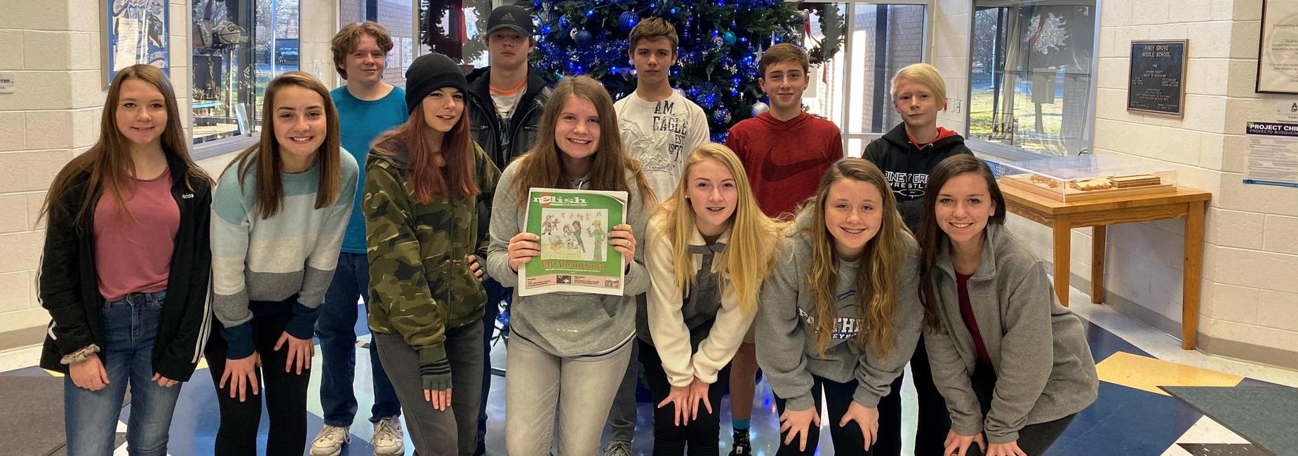 students posed in school lobby