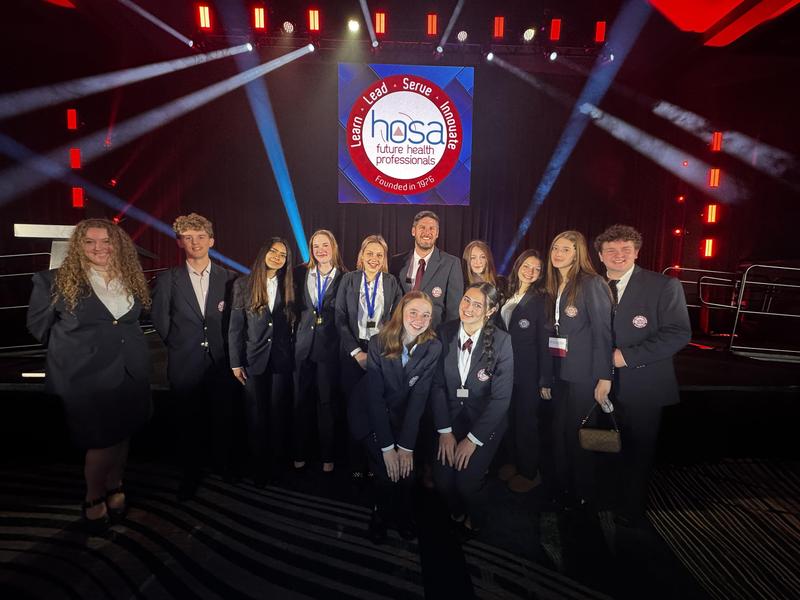 Students stand in a group at the Hosa state championships
