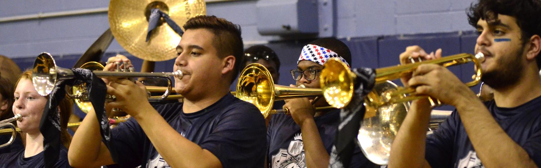 The Mustang Band performs at a pep rally.