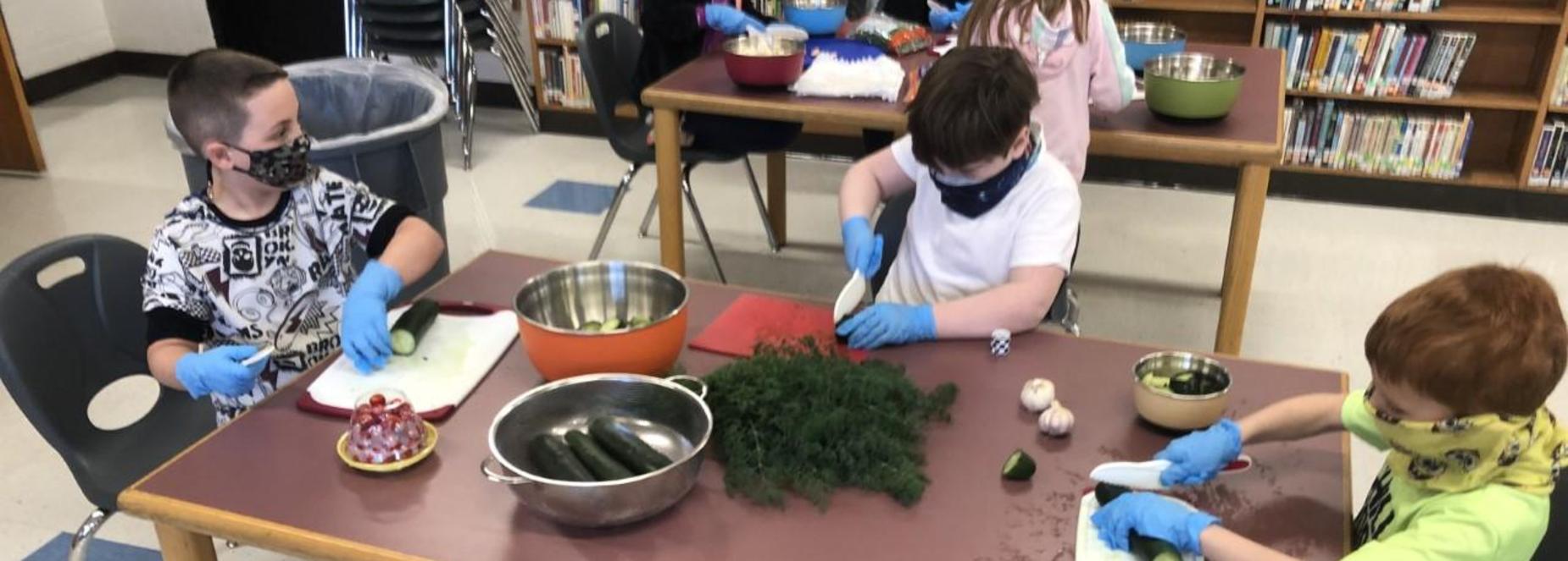 first graders cutting veggies