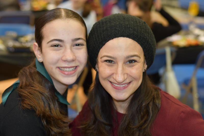 A mother and daughter posing together at the melave malka