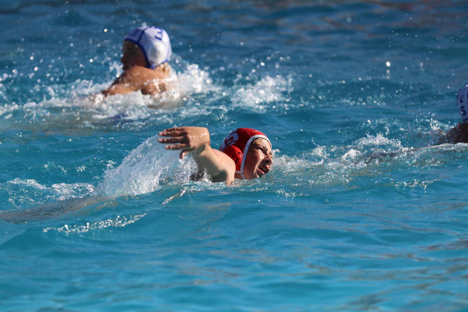 boys playing water polo against Madera
