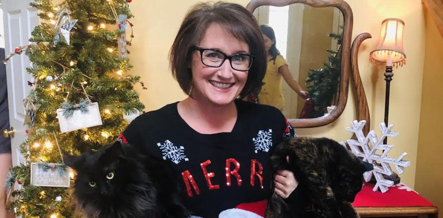 School Nurse in holiday attire with cats