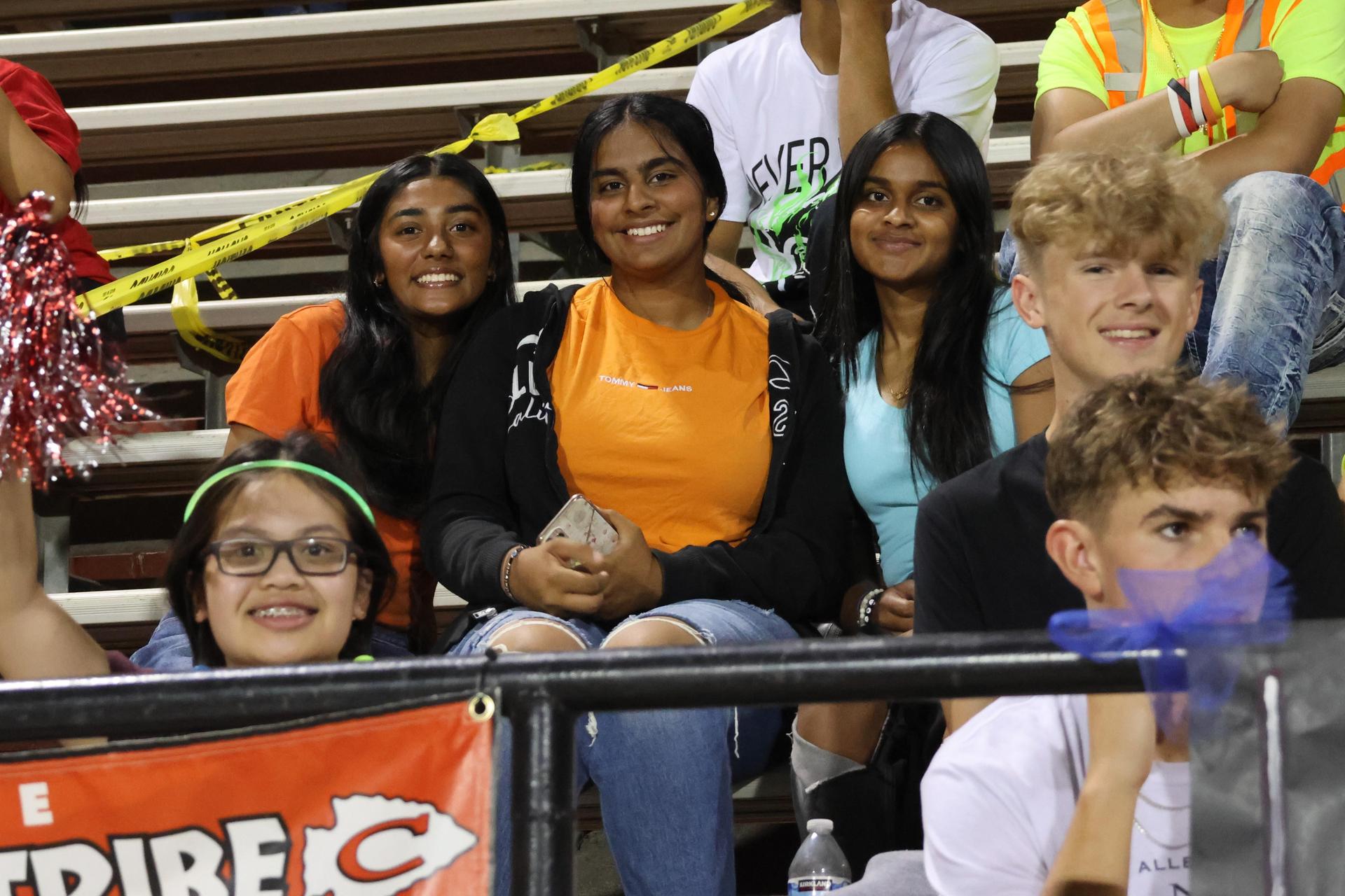 Students and community members enjoying the football game.