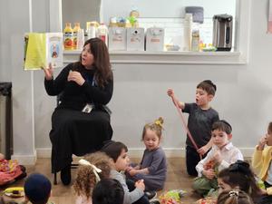 Morah Rivka reads a chanukah book