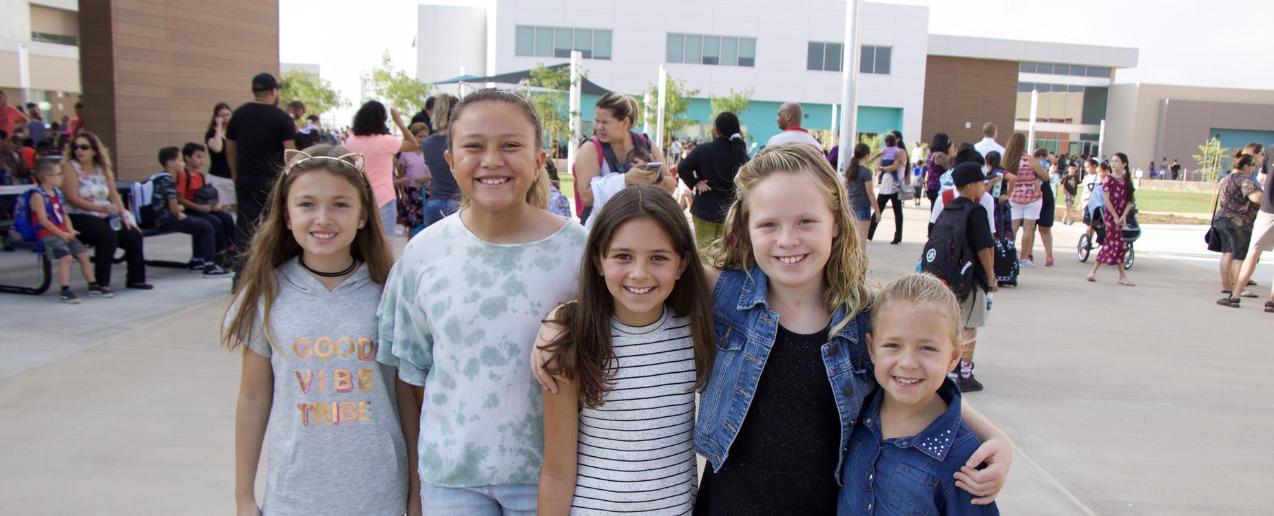 Group of students standing and smiling