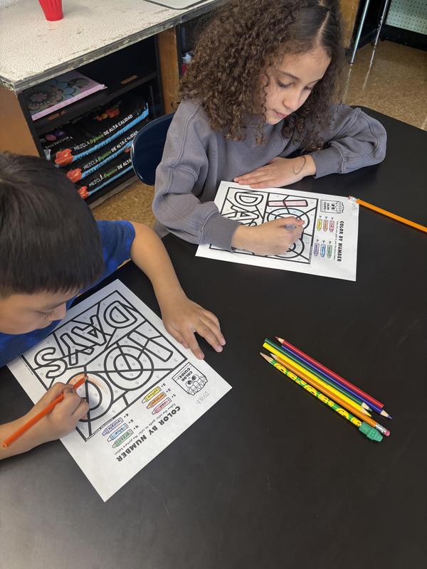 Students coloring for 100 days of school
