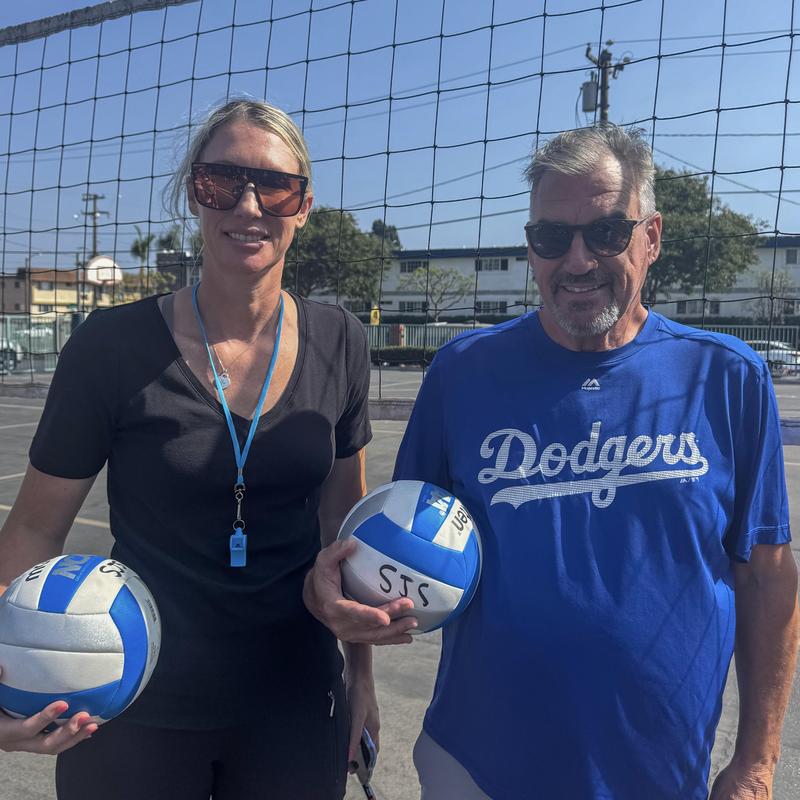 Volleyball Coach Kathleen and Coach William smiling