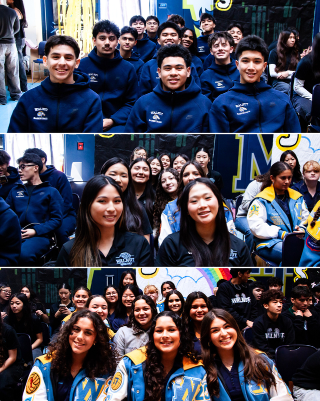 Group of students in matching sweatshirts sitting in rows at school assembly.