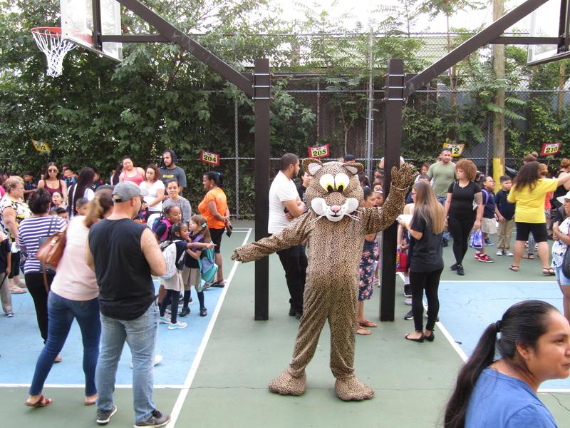 school mascot welcoming students and parents