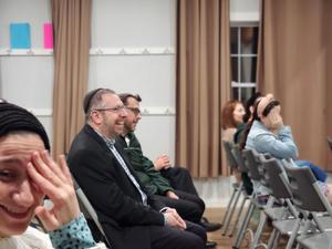 Parents crack up at one of Dr. Weisman's stories.
