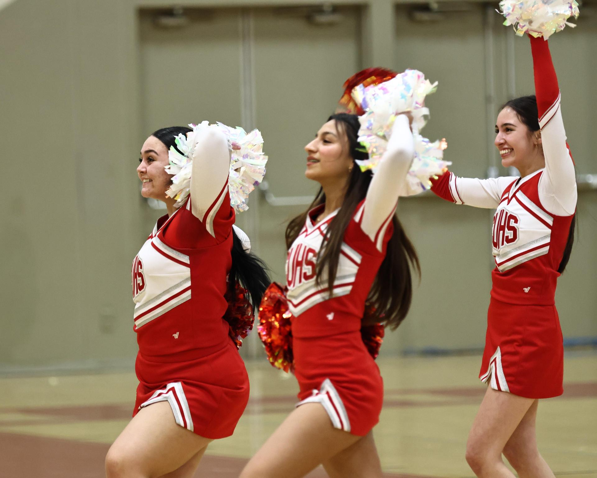 Varsity boys playing basketball against yosemite