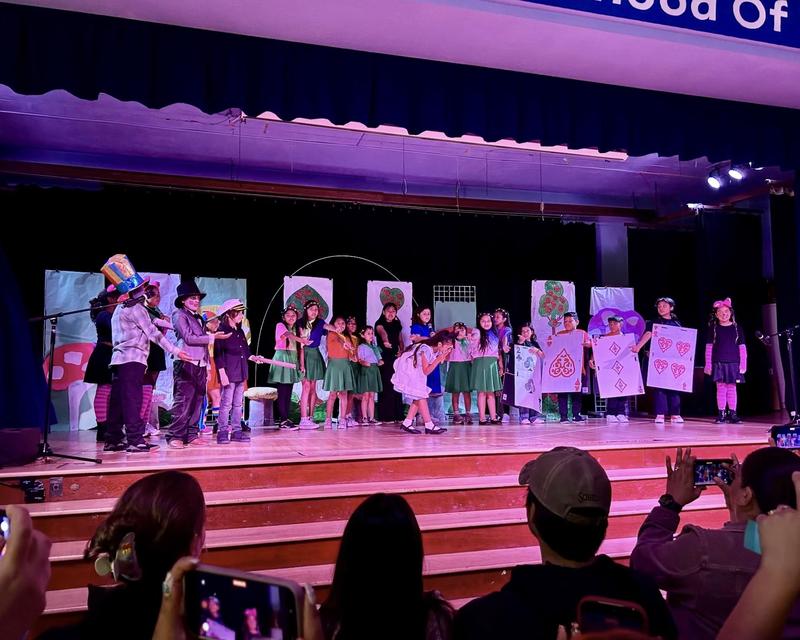 Students acting on stage
