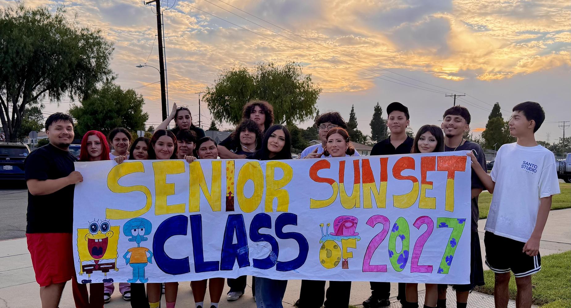 Senior Sunset picture of the banner and students facing forward.