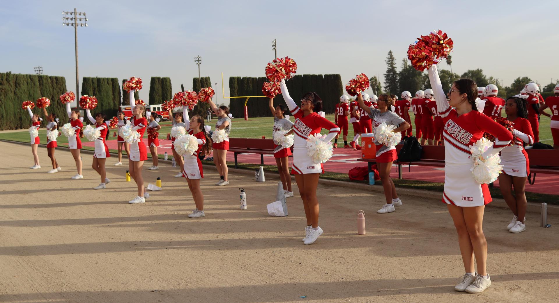 junior varsity cheerleaders in action at the Riverdale game