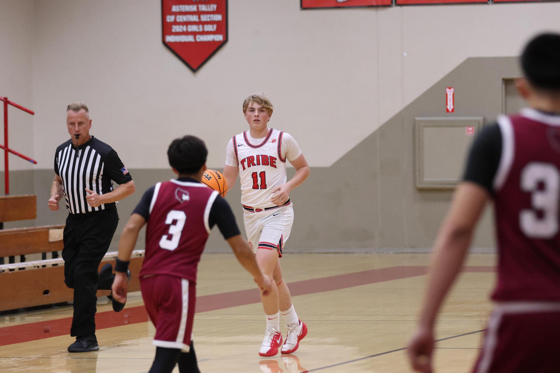 Varsity Boys Basketball playing vs. Orosi 58