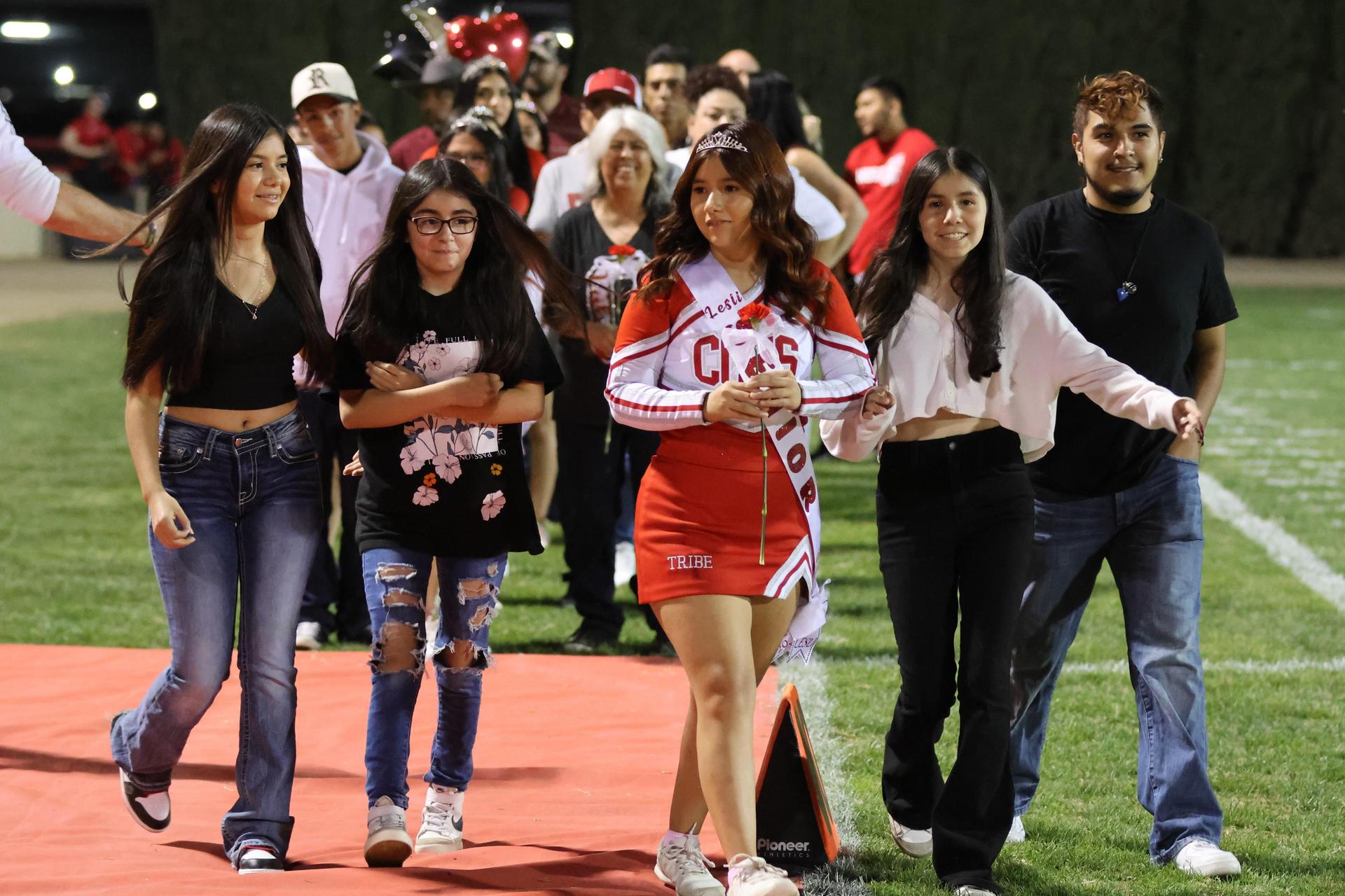 seniors and their escorts celebrating senior night