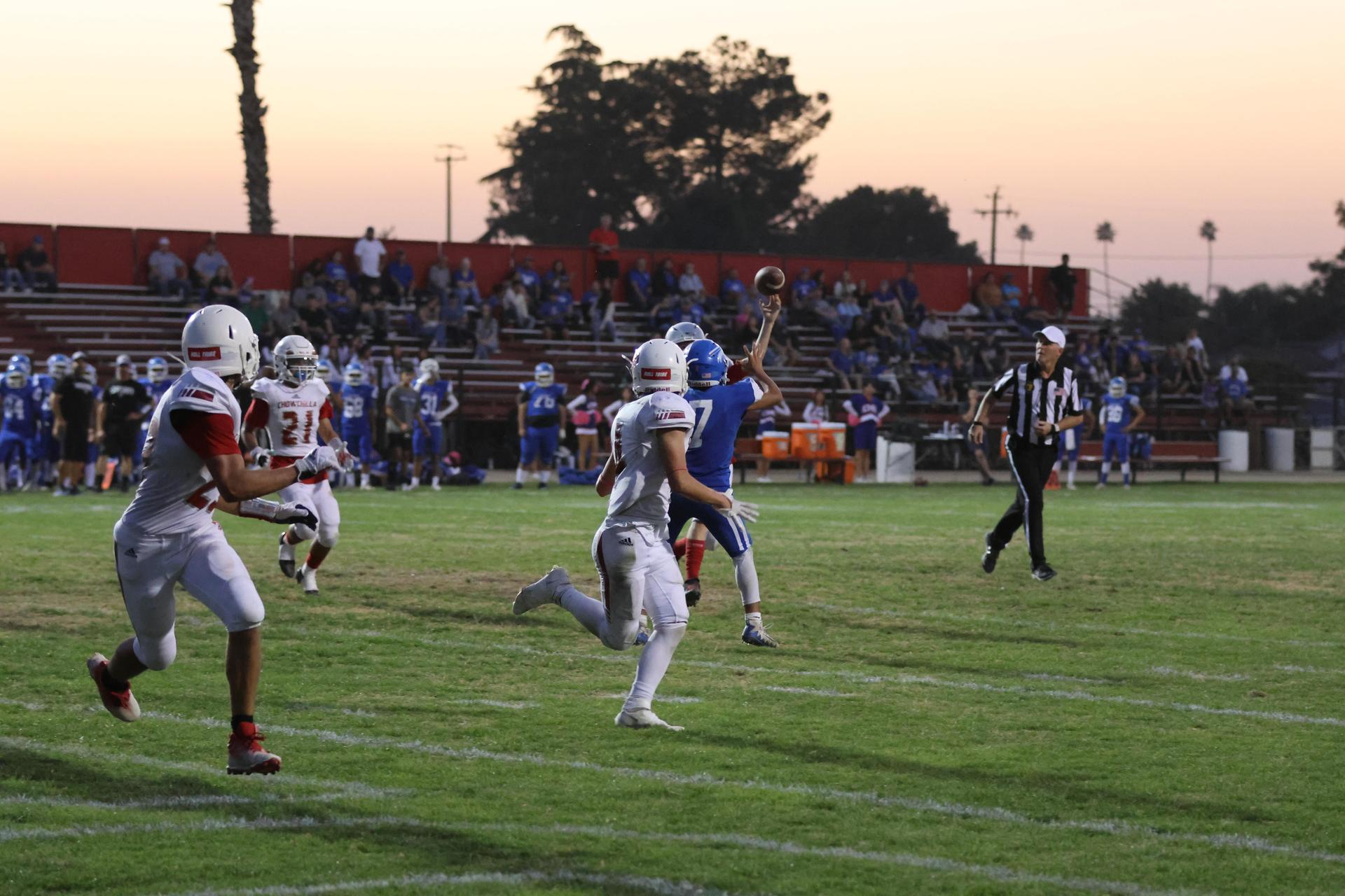 Junior Varsity football players in action against Caruthers