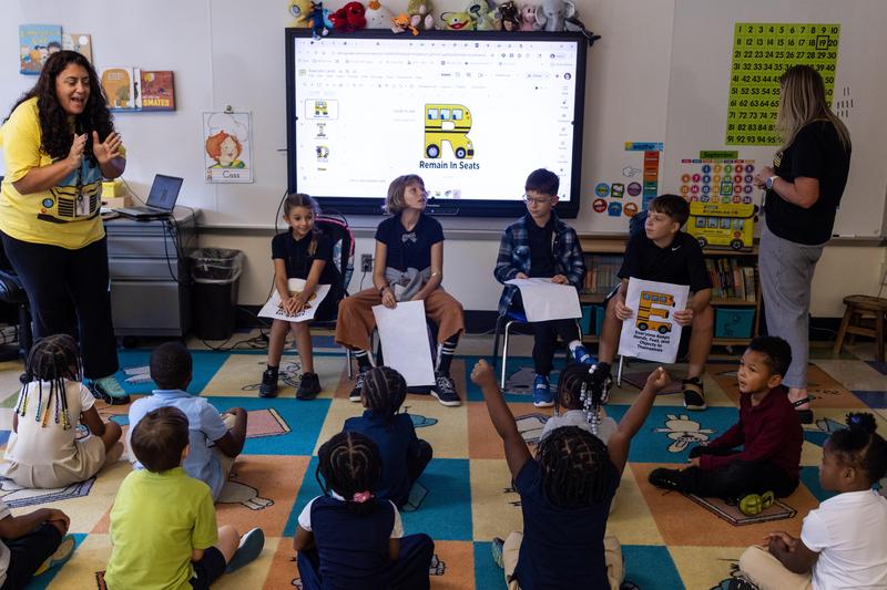 Fifth graders visit a kindergarten classroom