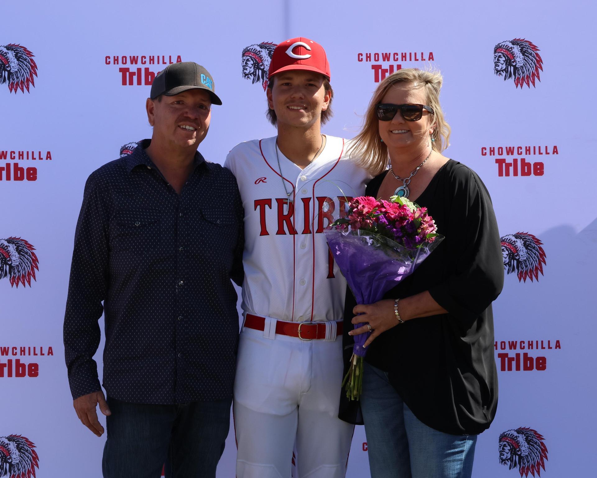 Seniors Posing With Teammates, Coaches, And Family