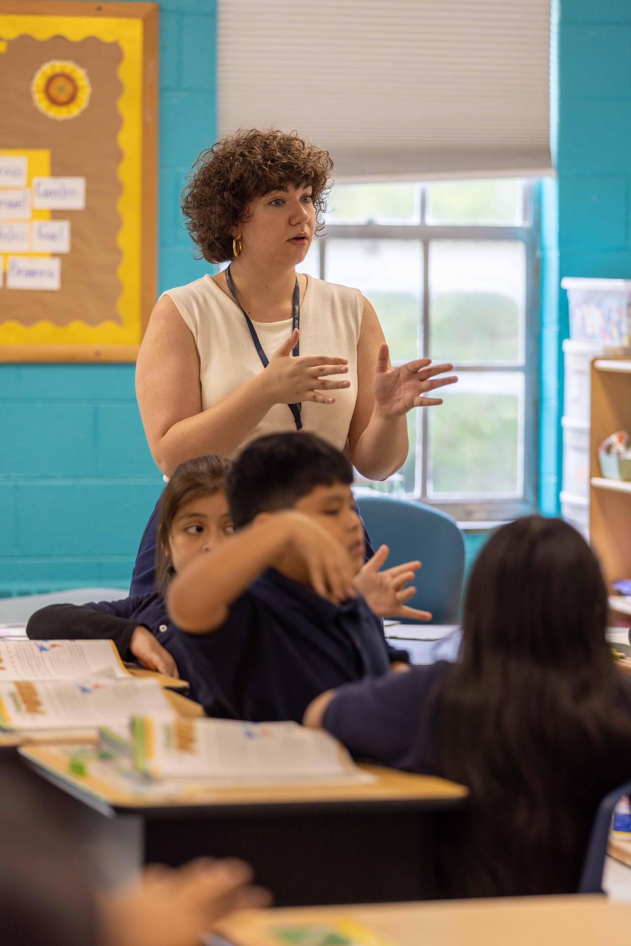 A teacher leads the class