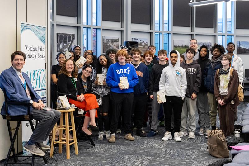 Clare Beams poses with students after their chat