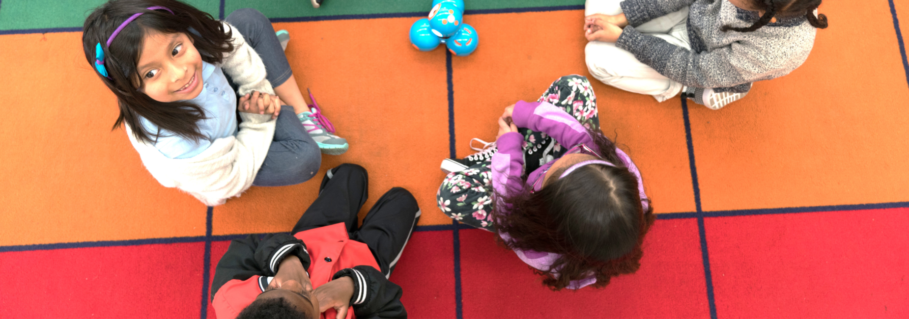 Kids Sitting on Mat