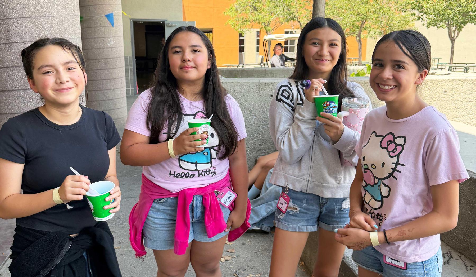 Four middle school girls with Kona Ice