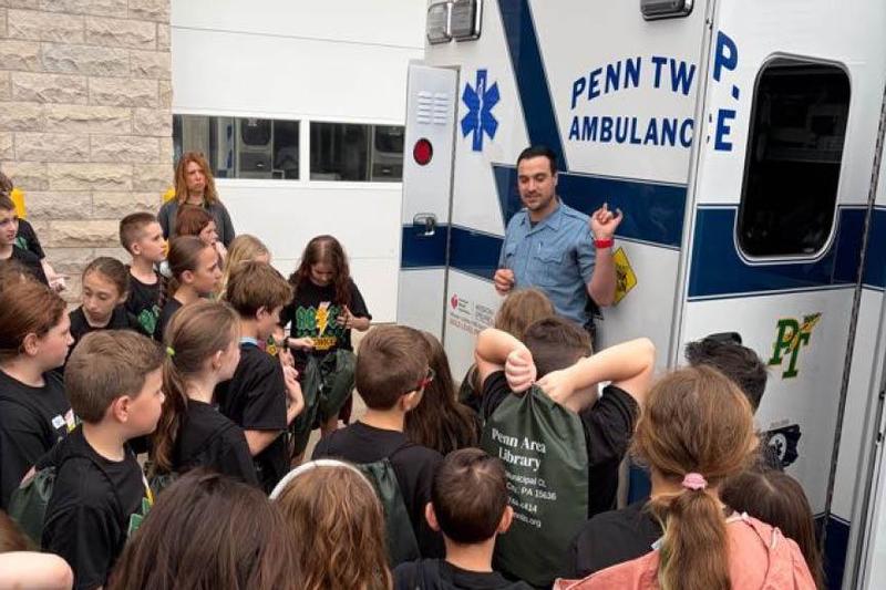 Penn Township Ambulance Assistant Chief, Ryan Satira, tells the students about his job as a paramedic
