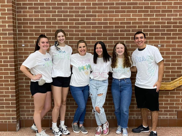 5 teens and their instructor in hand painted shirts