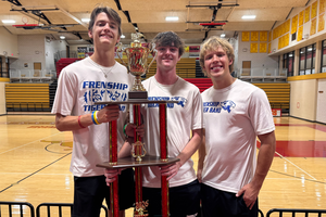 FHS drum majors with competition trophy