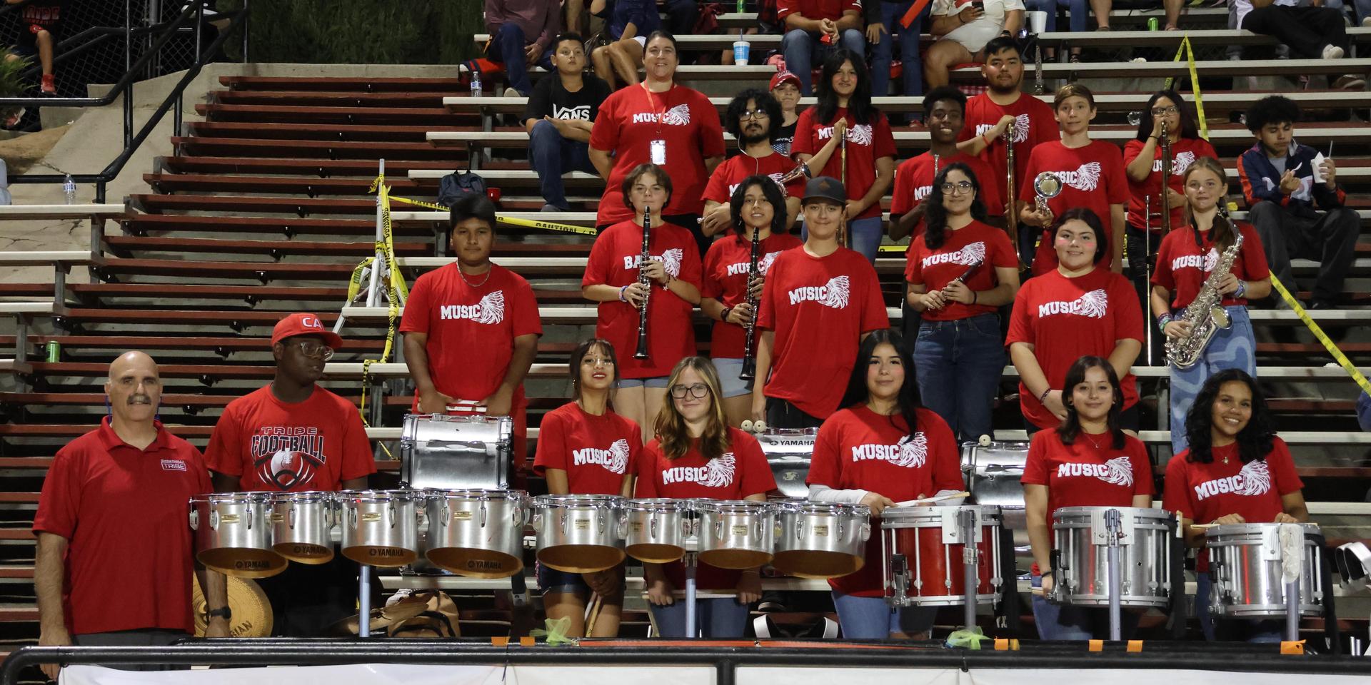 Students and community members enjoying the football game.