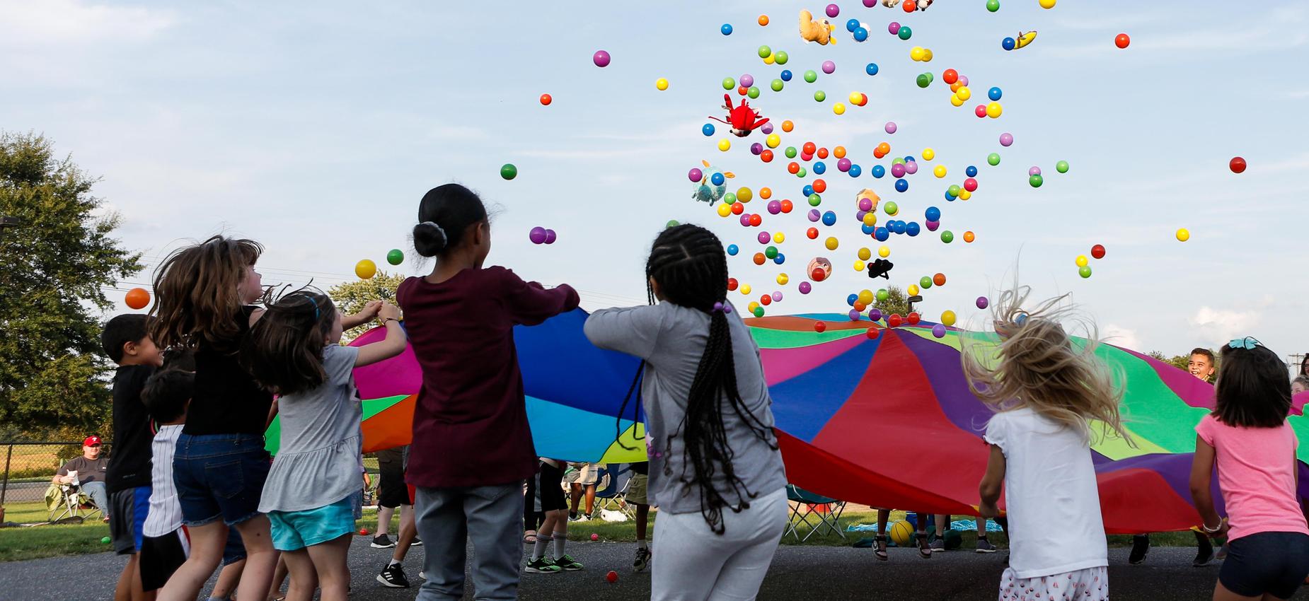 children playing parachute game