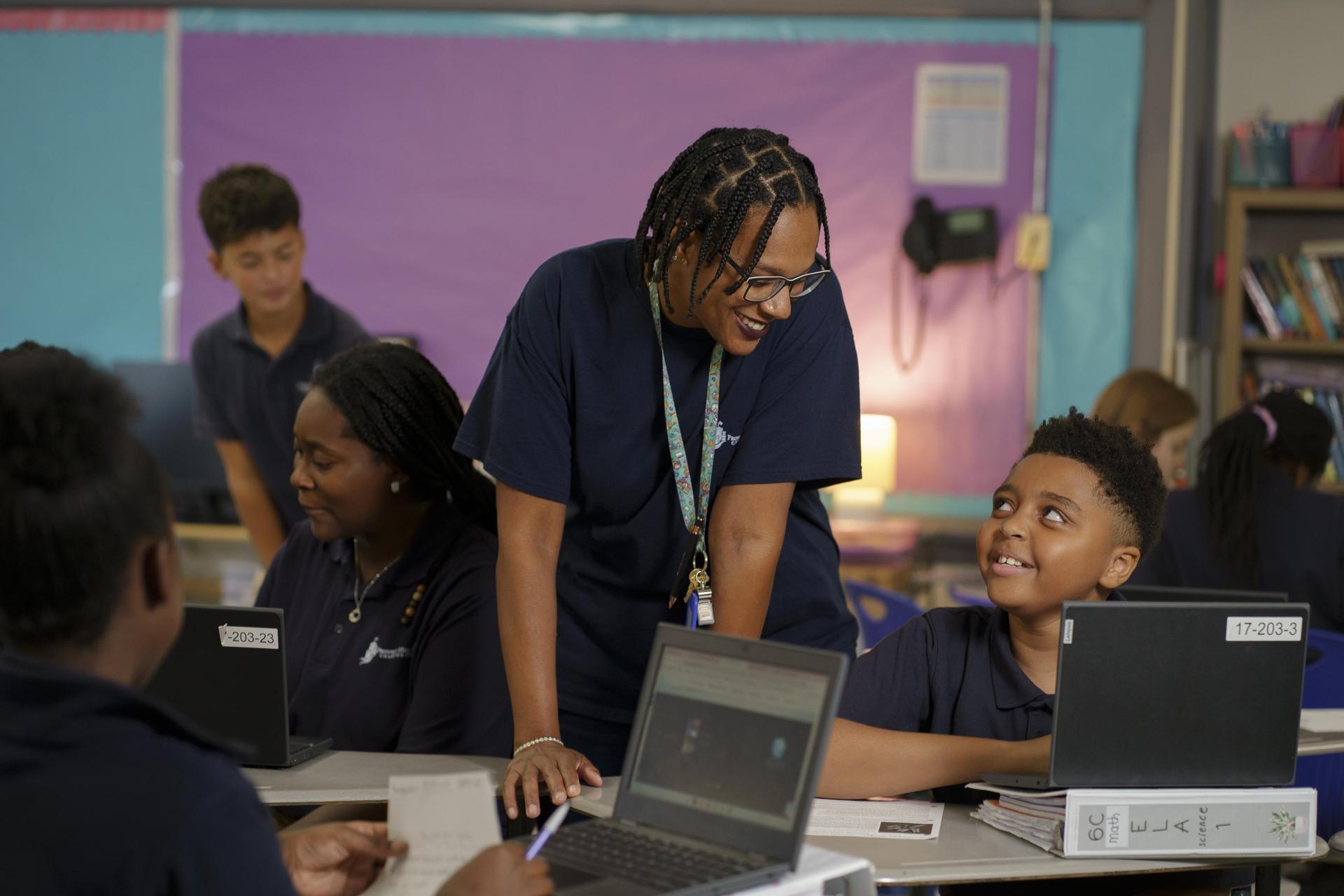 Staff member with an Upper Elementary student