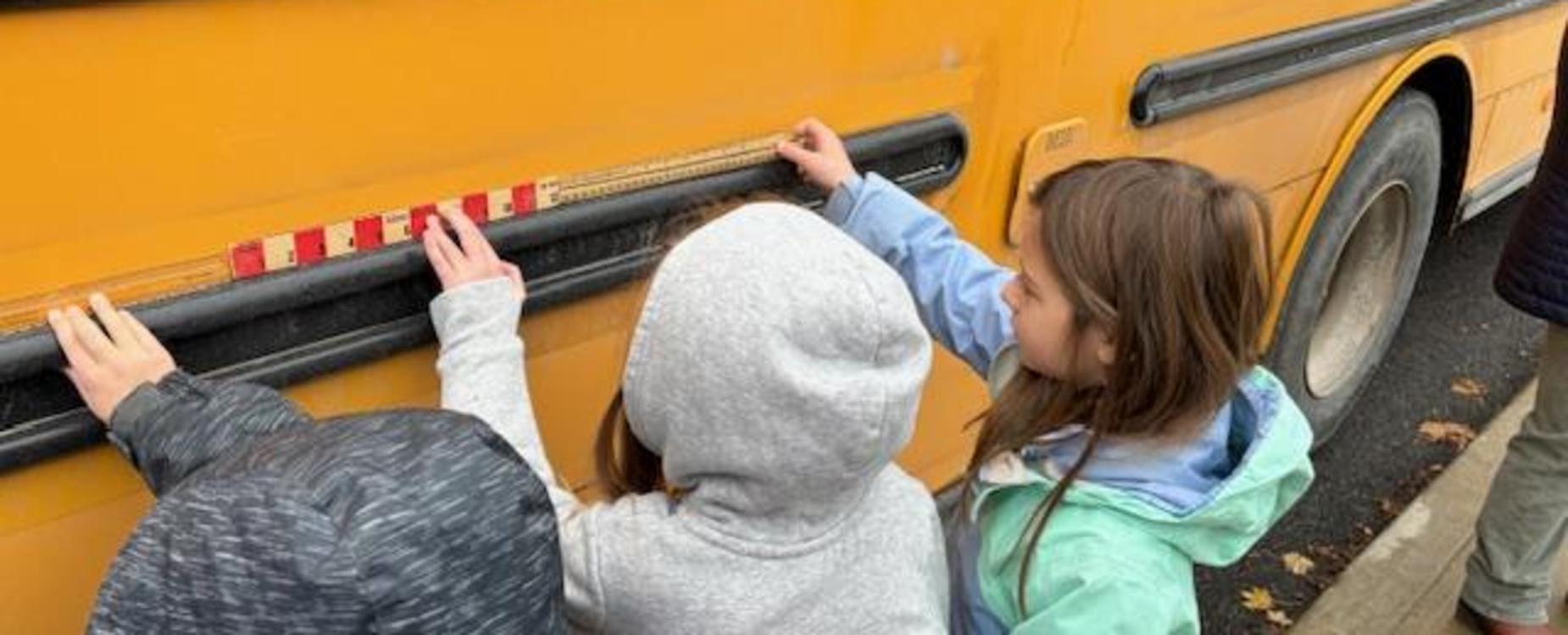 Measuring a school bus with rulers