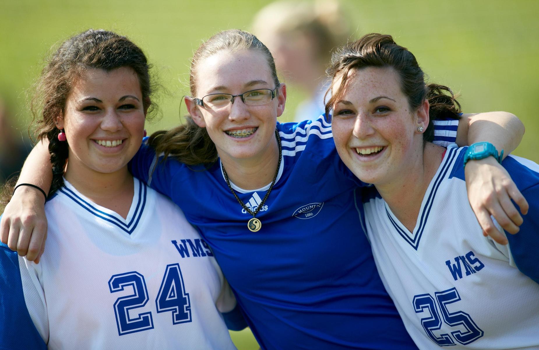 A group of soccer players posing for a picture.