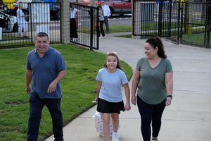 familly walking on path
